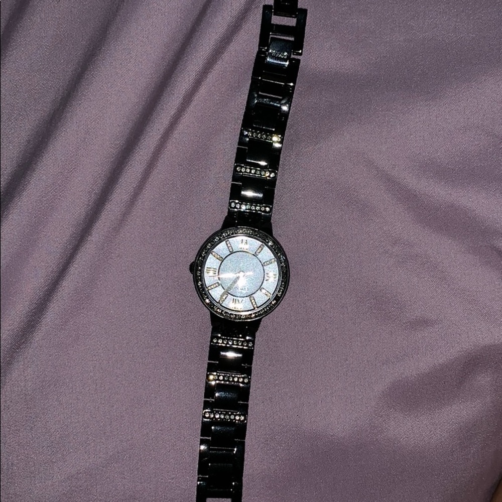 Fossil black, gold, and diamond faced watch